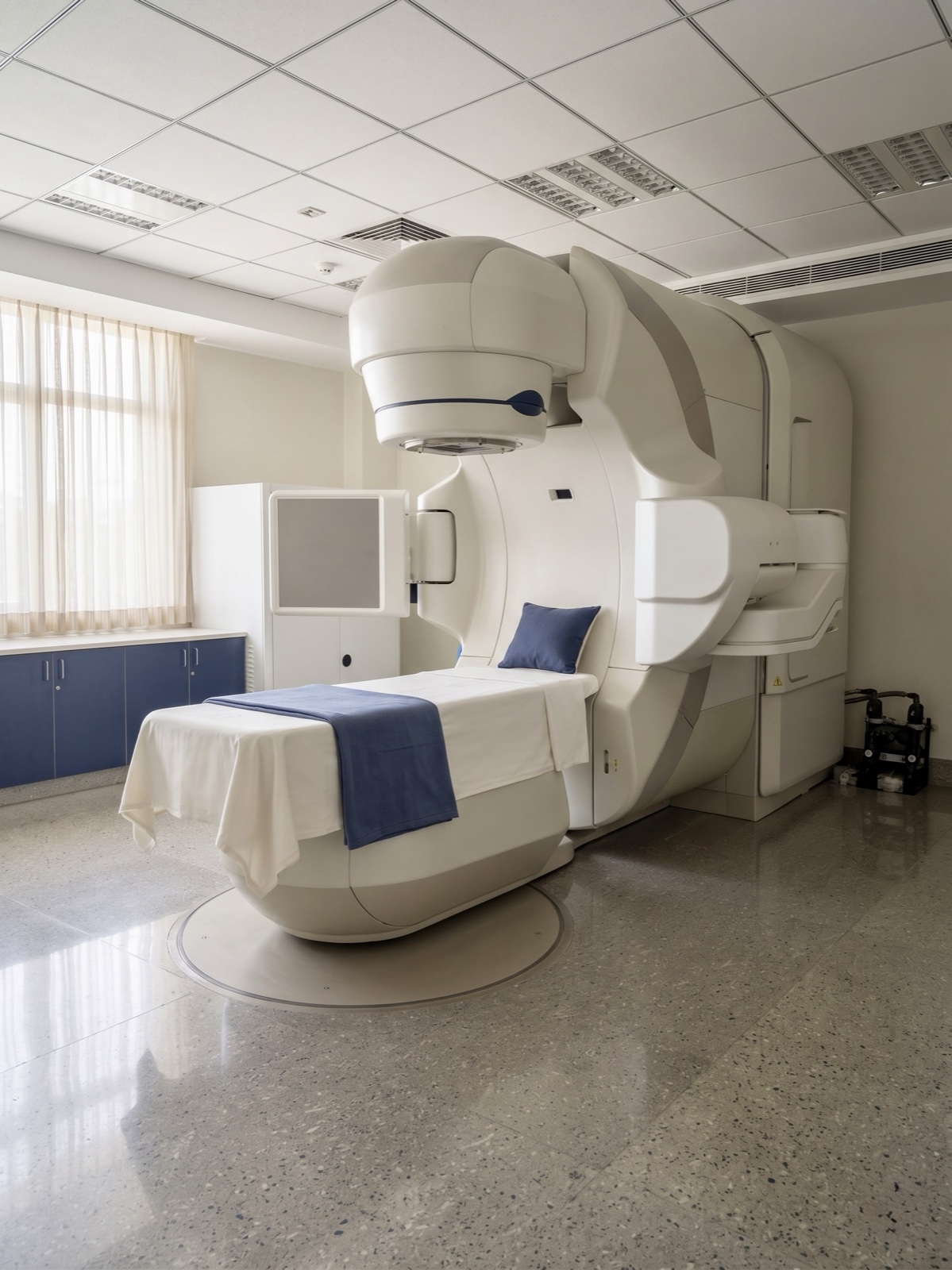 A modern radiation therapy treatment room with a linear accelerator
